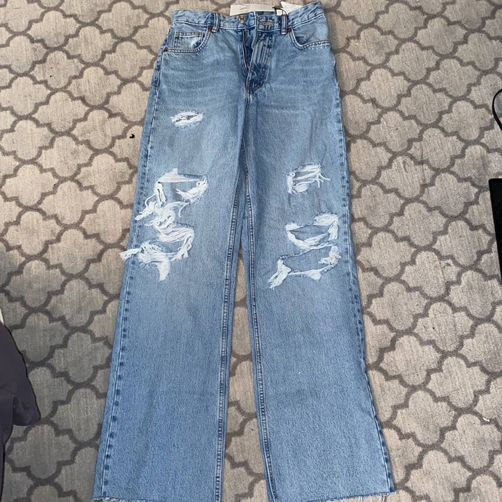 Zara brand new high rise wide leg Jean with rips. Never been worn. New with tags
